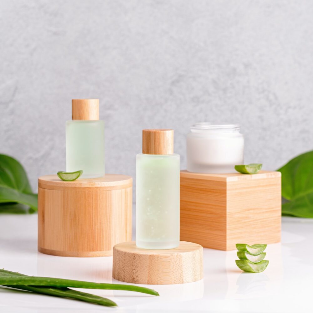 Natural cosmetics with aloe vera on podiums